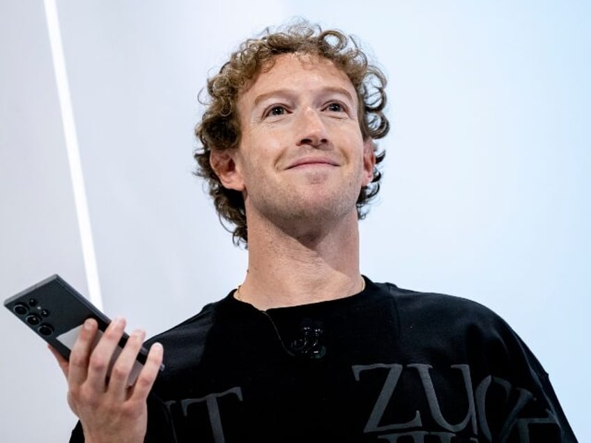 Mark Zuckerberg smirks on stage