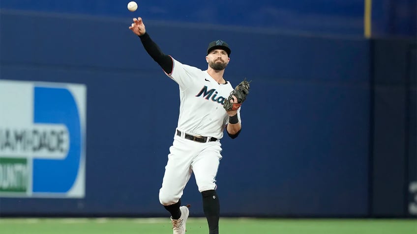 marlins snap eight game losing streak with extra innings victory over rockies