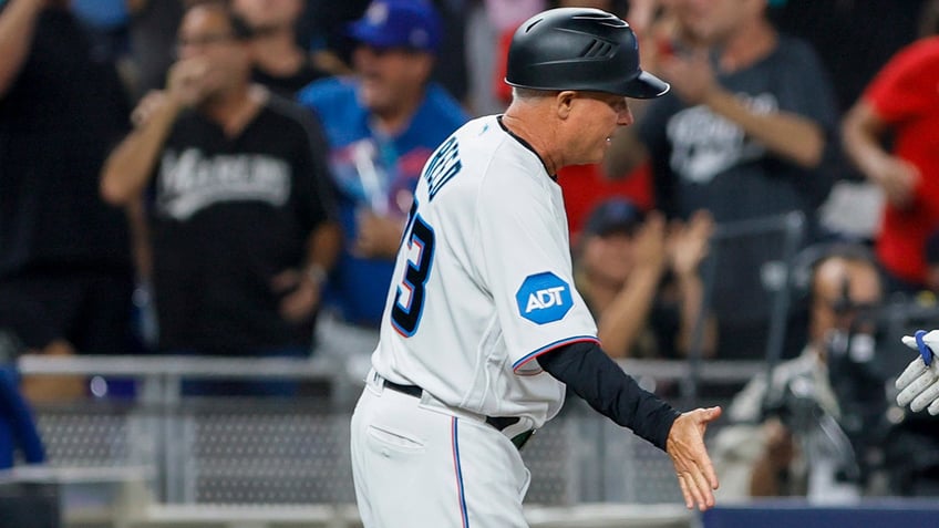 marlins third base coach fractures leg after getting hit by foul ball