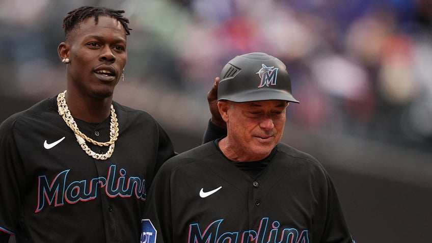 marlins third base coach fractures leg after getting hit by foul ball