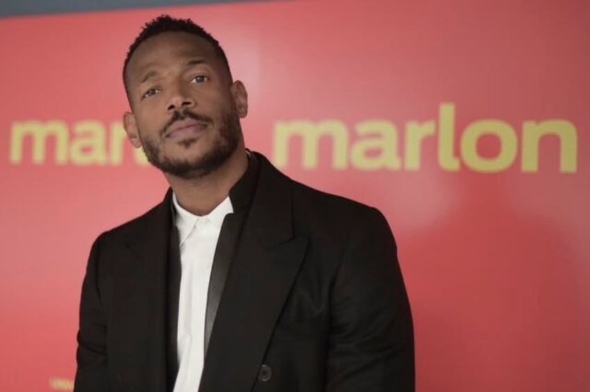 marlon wayans says he is being unfairly prosecuted after being by racially targeted by gate agent