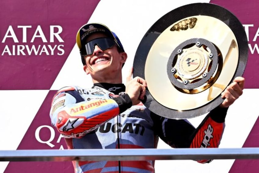 Gresini Racing MotoGP team rider Marc Marquez of Spain celebrates on the podium after winn