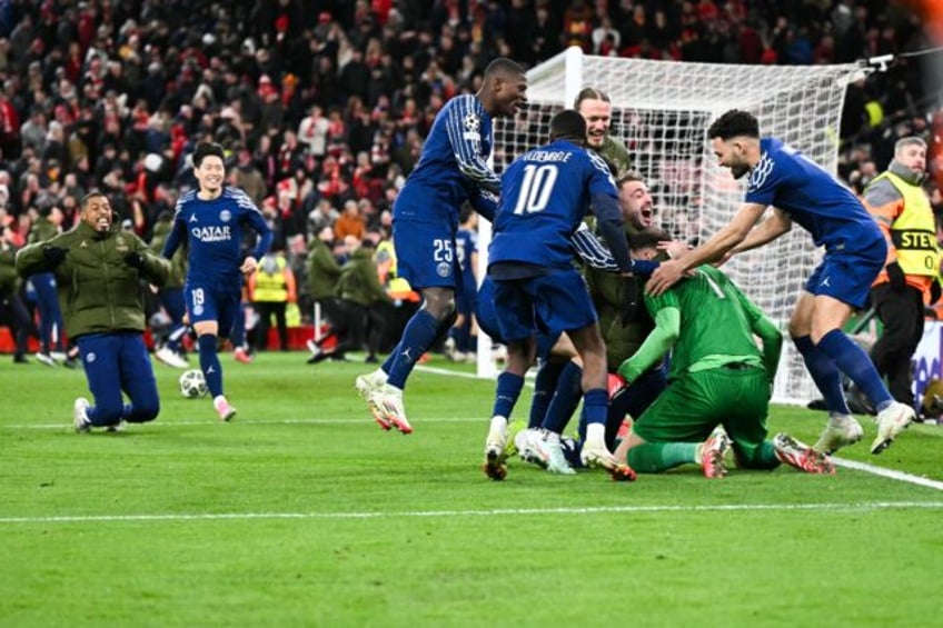 Paris Saint-Germain players celebrate after beating Liverpool on penalties to reach the Ch