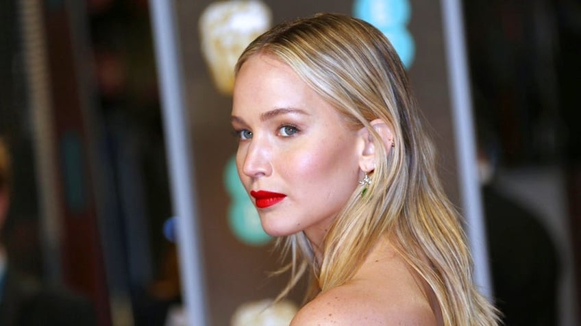 Actress Jennifer Lawrence poses for photographers upon arrival at the BAFTA 2018 Awards in London, Sunday, Feb. 18, 2018. (Photo by Joel C Ryan/Invision/AP)