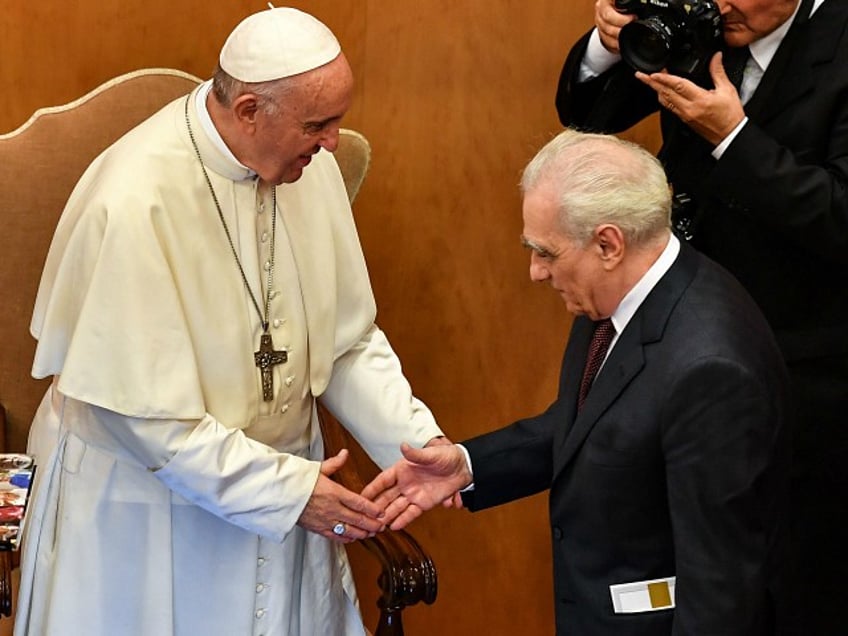 Pope Francis and US director Martin Scorsese (R) shake hands within an intergenerational dialogue themed 'The Wisdom of Time' with some young people and a group of elderly people at the Augustinianum Patristic Institute of higher education in Rome on October 23, 2018. (Photo by Alberto PIZZOLI / AFP) (Photo credit should read ALBERTO PIZZOLI/AFP/Getty Images)