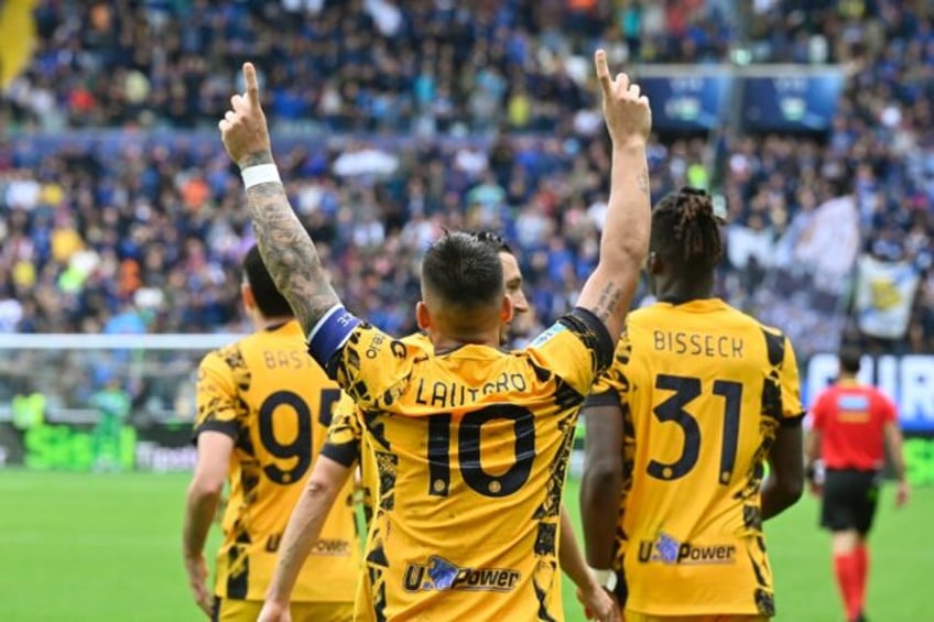 Lautaro Martinez celebrates scoring Inter Milan's second goal during their 3-2 Serie A win