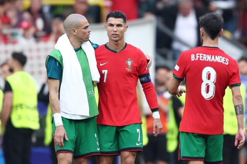 Pepe (L) with fellow veteran Cristiano Ronaldo at the end of Portugal's 3-0 win over Turke