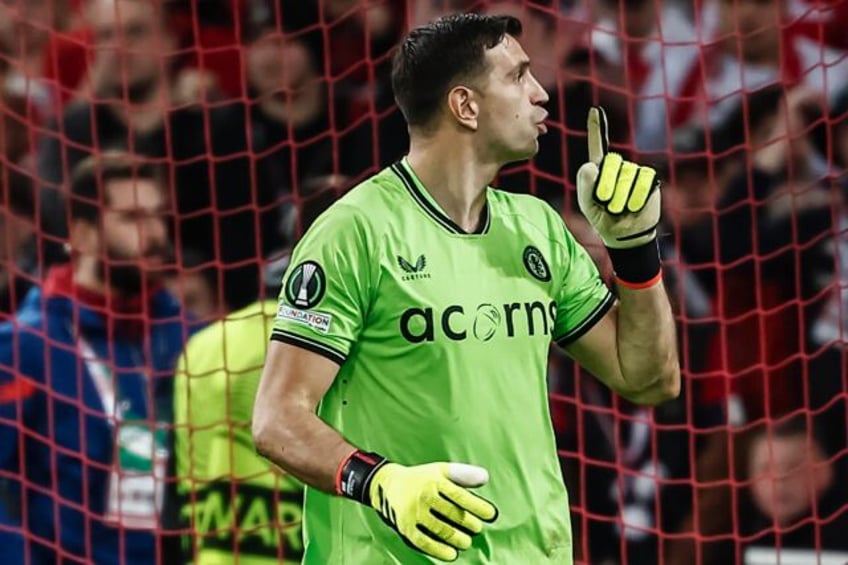 Emiliano Martinez quietens the crowd during the penalty shootout