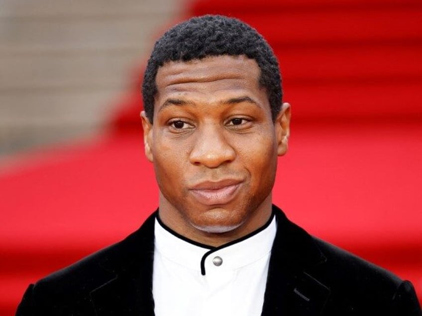 Actor Jonathan Majors poses on the red carpet after arriving to attend the World Premiere of the James Bond 007 film "No Time to Die" at the Royal Albert Hall in west London on September 28, 2021. - Celebrities and royals walk the red carpet in central London on Tuesday …