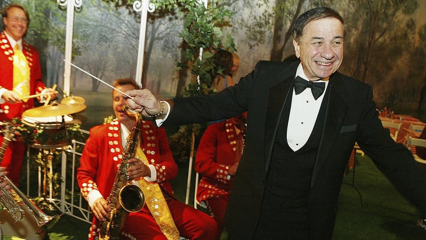 Richard M. Sherman conducting a band