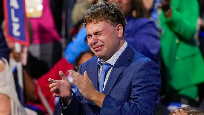 Gus Walz cries as Democratic vice presidential nominee Minnesota Gov. Tim Walz speaks during the Democratic National Convention