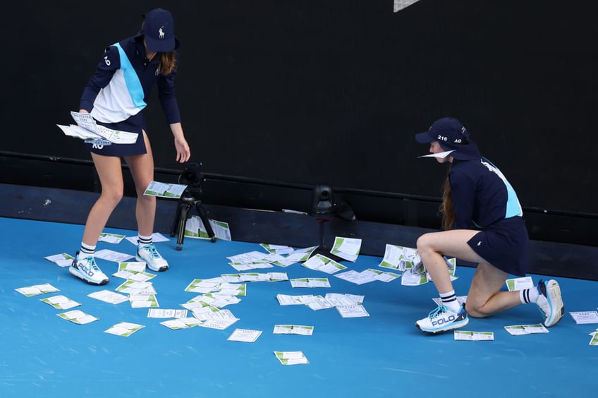 masked pro palestinian protester dumps leaflets on court disrupts australian open tennis match