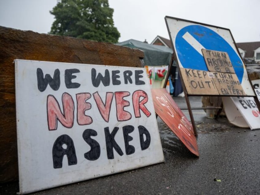 LLANELLI, WALES - JULY 30: Protest signs outside the Stradey Park Hotel on July 30, 2023 i