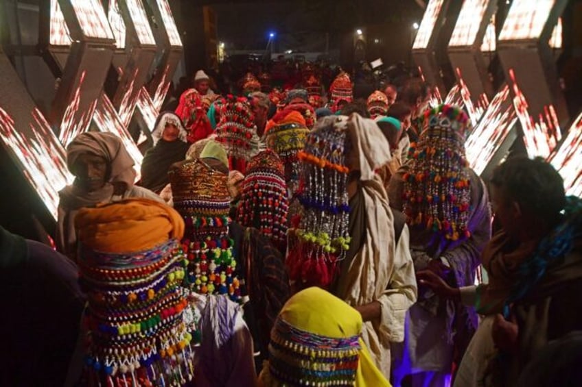 Pakistani Hindu couples arrive for a mass marriage ceremony organised by the Pakistan Hindu Council in Karachi