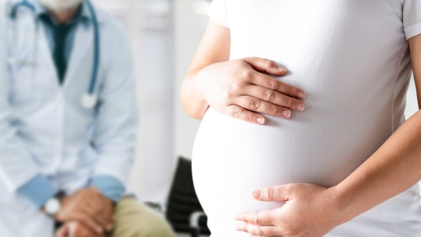 Pregnant woman at doctors office