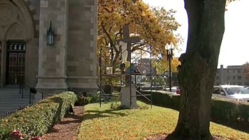 massachusetts man allegedly broke arms off crucifix outside boston cathedral after swinging from it