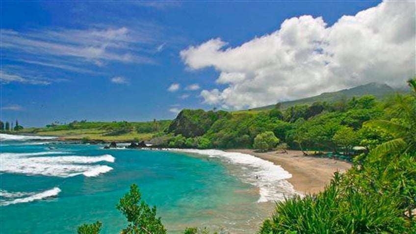 This undated file photo provided by Ron Dahlquist for the Maui Visitors Bureau shows Hamoa Beach in Maui, Hawaii.