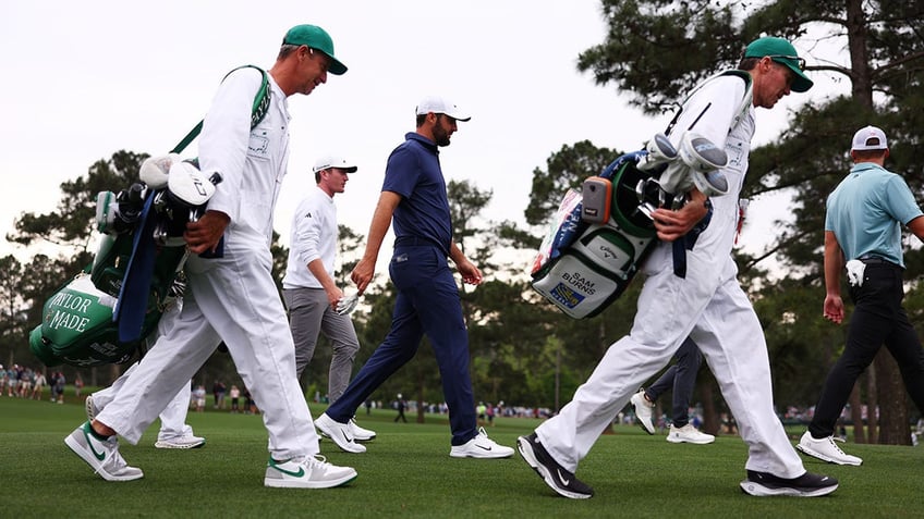 Scottie Scheffler walks the course