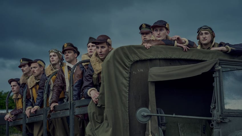 soldiers riding a truck in masters of the air 