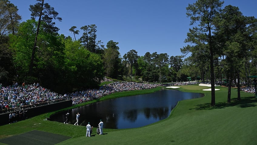 Players skip balls across water