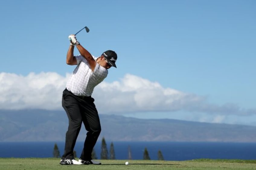 Leader Hideki Matsuyama of Japan plays his shot from the 11th tee during the second round