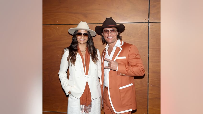 Matthew McConaughey and Camila Alves McConaughey in cowboy hats