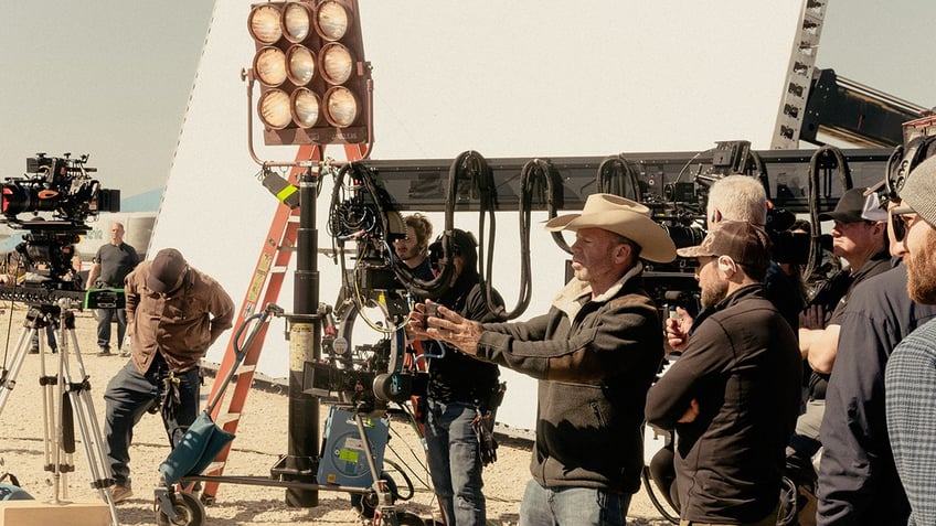 Behind the scenes photo of Taylor Sheridan directing