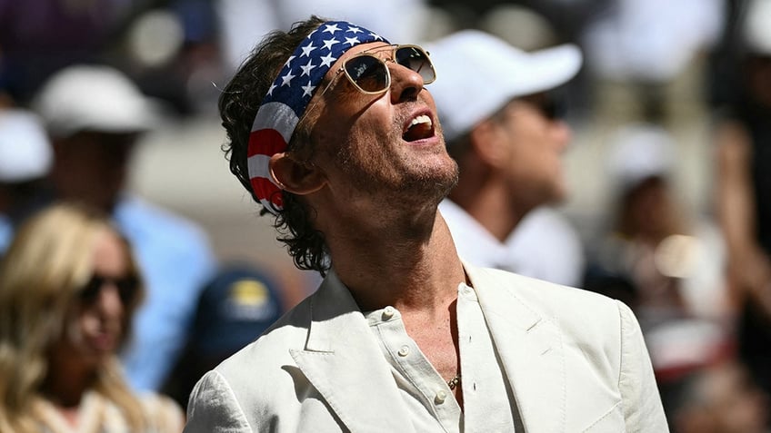 Matthew McConaughey cheers on tennis players at the US Open