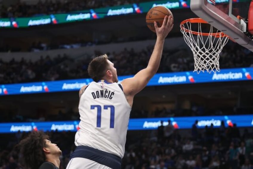 Dallas star Luka Doncic rises to teh basket in the Mavericks' NBA victory over the Orlando