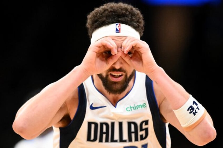 Klay Thompson of the Dallas Mavericks reacts after a three-point basket in an NBA victory