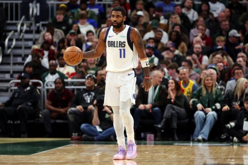 The Dallas Mavericks say star guard Kyrie Irving has a heel contusion after a teammate fell on his foot in a scary incident in the team's NBA win over the Portland Trail Blazers