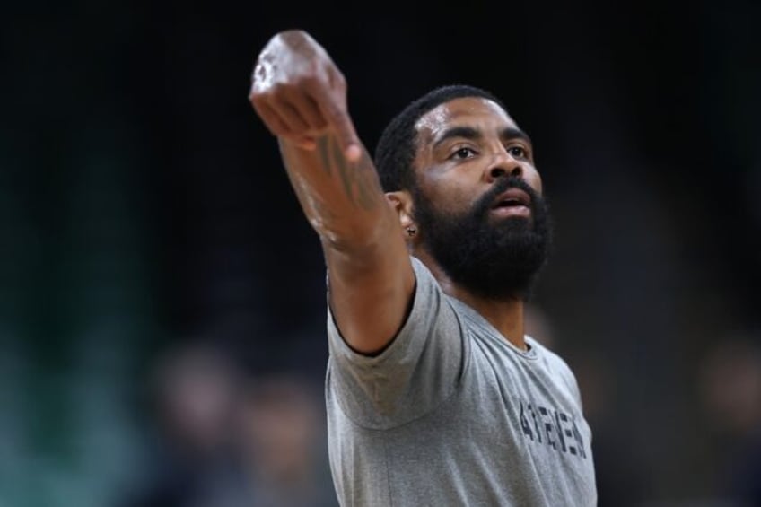 The Dallas Mavericks say star guard Kyrie Irving is recovering from surgery to repair a br