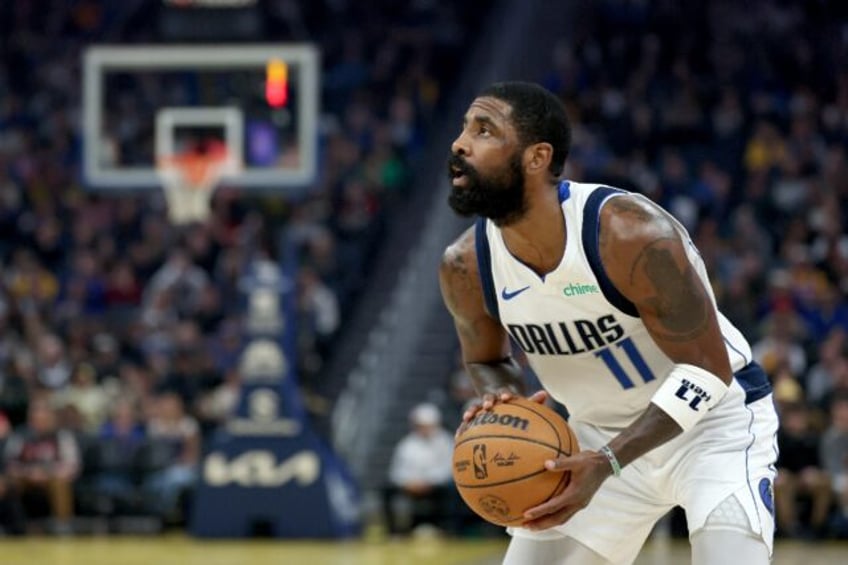 Kyrie Irving of the Dallas Mavericks shoots the ball in an NBA Game against the Golden Sta