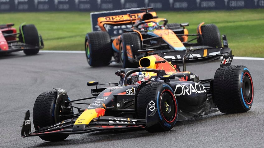 max verstappen takes home victory at rainy belgian grand prix