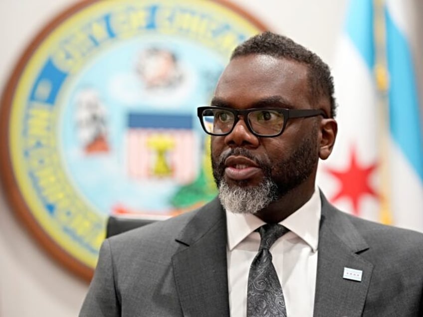 Chicago Mayor Brandon Johnson responds to a question in his City Hall office during an int