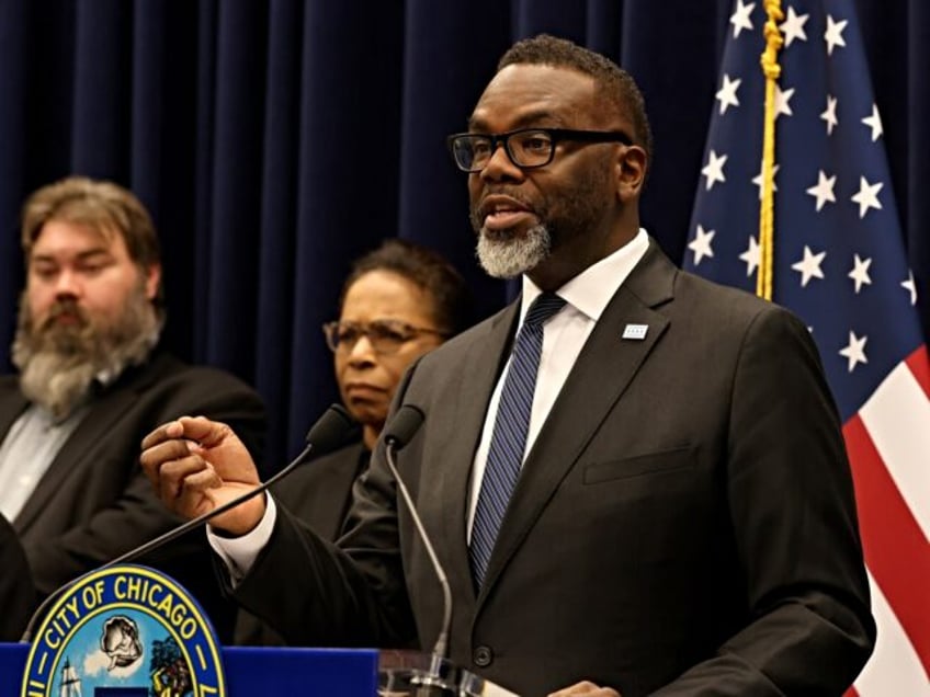 Mayor Brandon Johnson answers questions from reporters following a Chicago City Council me