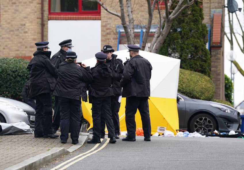 Police officers at the scene near Bywater Place in Surrey Quays, south east London, where a man has died after being shot by armed police responding to calls for help in the early hours of this morning. A man aged in his 30s who was reportedly armed with a crossbow trying to force his way into a building in Bywater Place just before 5am on Tuesday and was threatening to hurt the people inside. Picture date: Tuesday January 30, 2024. (Photo by Lucy North/PA Images via Getty Images)