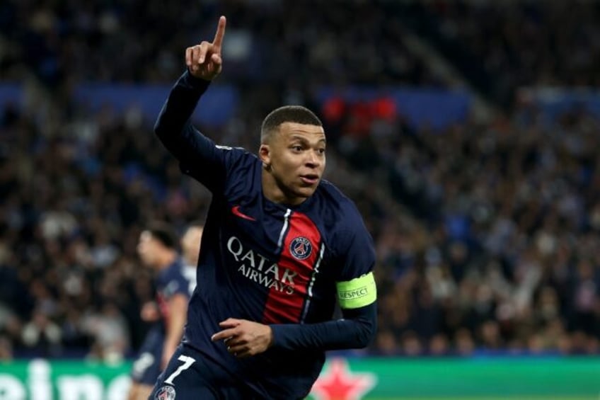 Paris Saint-Germain forward Kylian Mbappe celebrates scoring his team's second goal as the