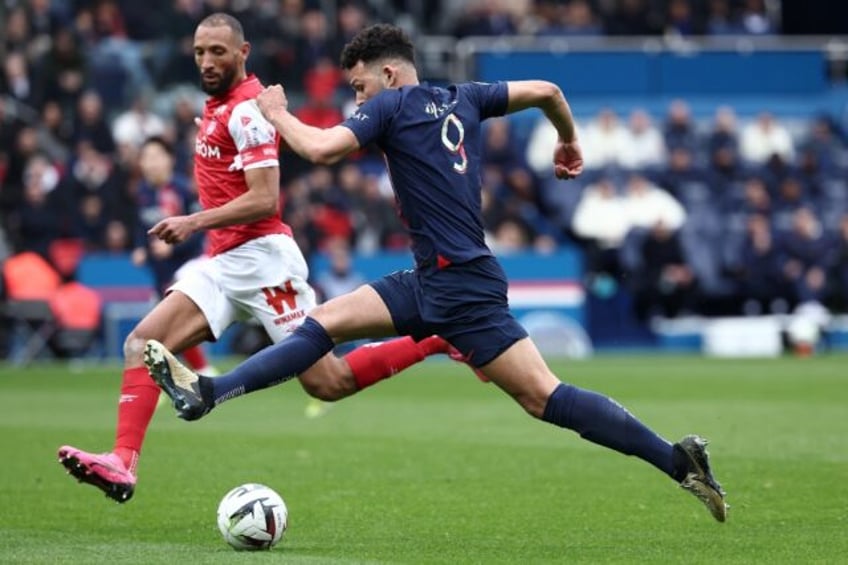 PSG's Goncalo Ramos (R) takes on Reims captain Yunis Abdelhamid during the 2-2 draw in Lig