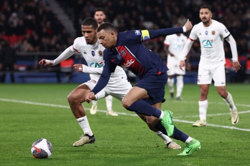 Kylian Mbappe is watched closely by Jean-Clair Todibo during Paris Saint-Germain's French