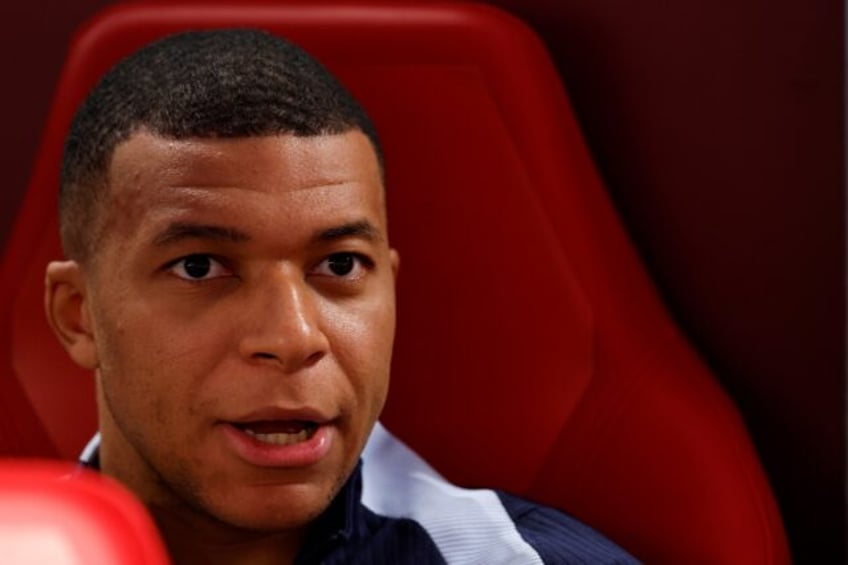 Kylian Mbappe started on the bench after breaking his nose just four days ago