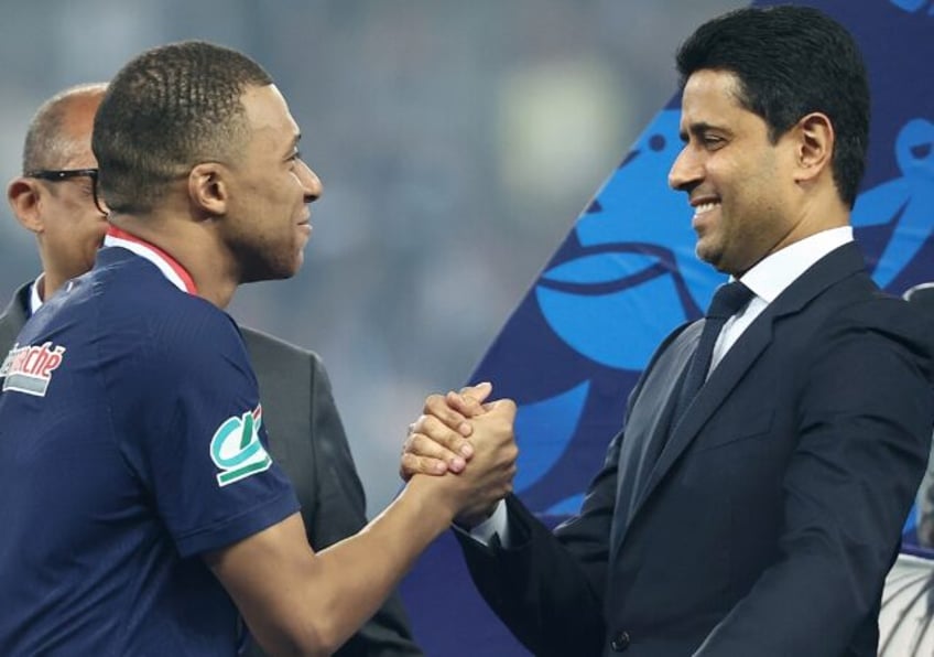 France star Kylian Mbappe (L) and Paris Saint-Germain president Nasser Al-Khelaïfi (R) af