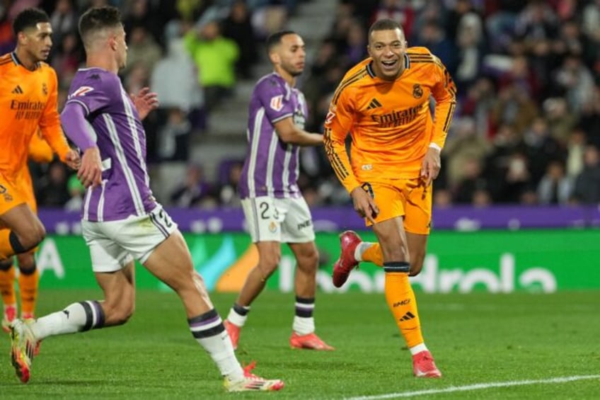 Real Madrid's French forward Kylian Mbappe celebrates scoring his team's third goal from t