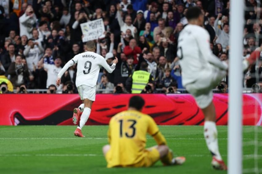 Real Madrid's French forward Kylian Mbappe celebrates scoring the opening goal against Ray