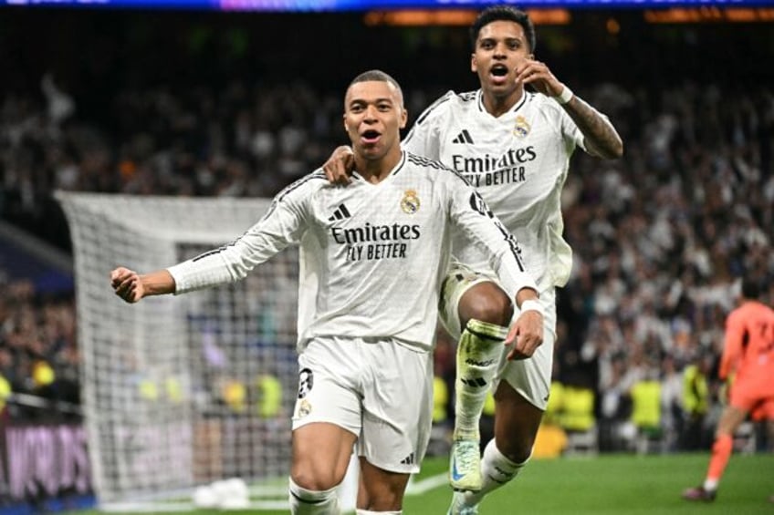 Real Madrid's French forward Kylian Mbappe celebrates scoring his team's second goal in th