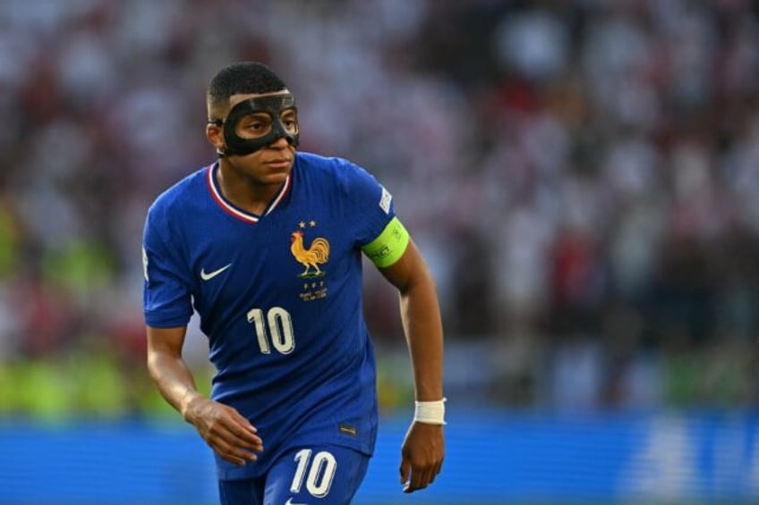 Kylian Mbappe, wearing a mask over his broken nose, returned to action and scored in Franc