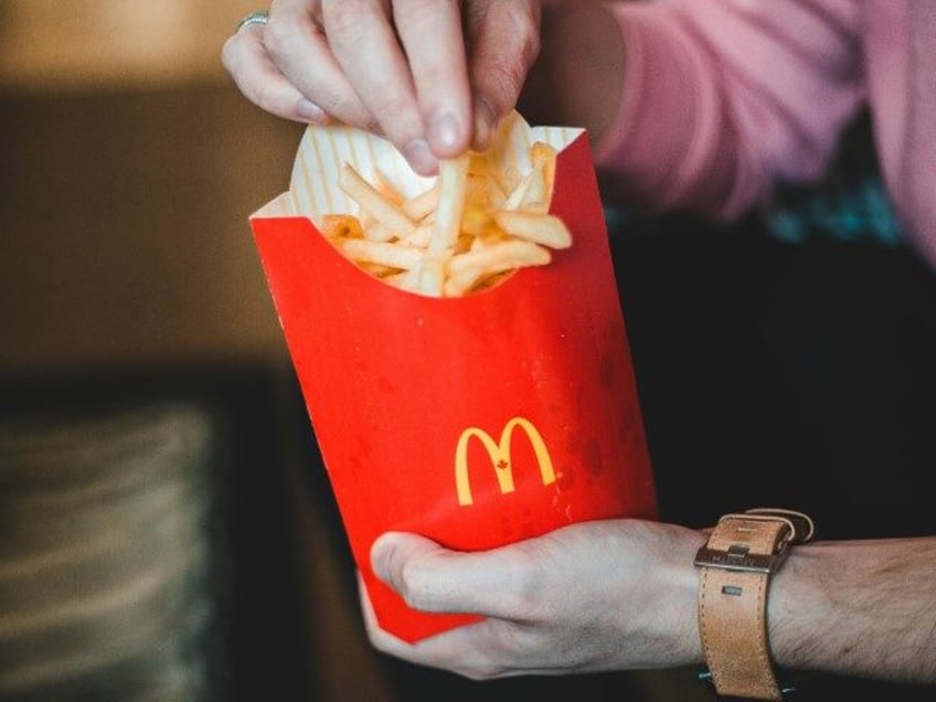 Photo Of Person Holding McDonald's Fries