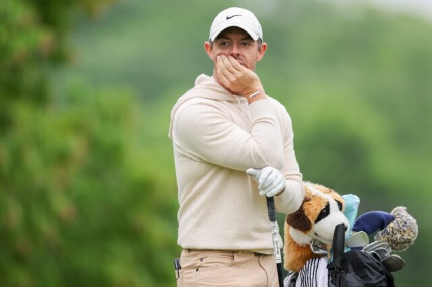 Second-ranked Rory McIlroy of Northern Ireland watches from the 18th tee during a practice