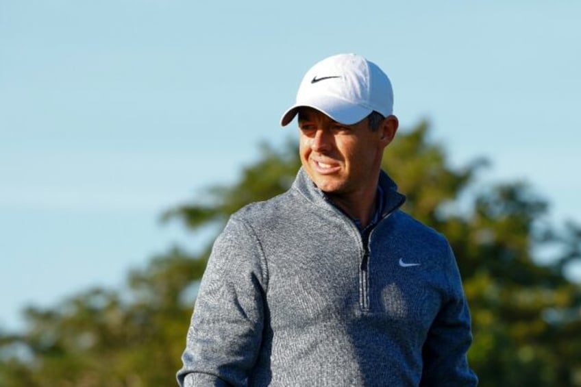 World number two Rory McIlroy of Northern Ireland watches during a practice round ahead of