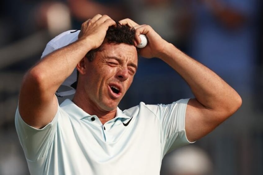 Rory McIlroy reacts after missing a four-foot par putt at the 18th hole in the final round